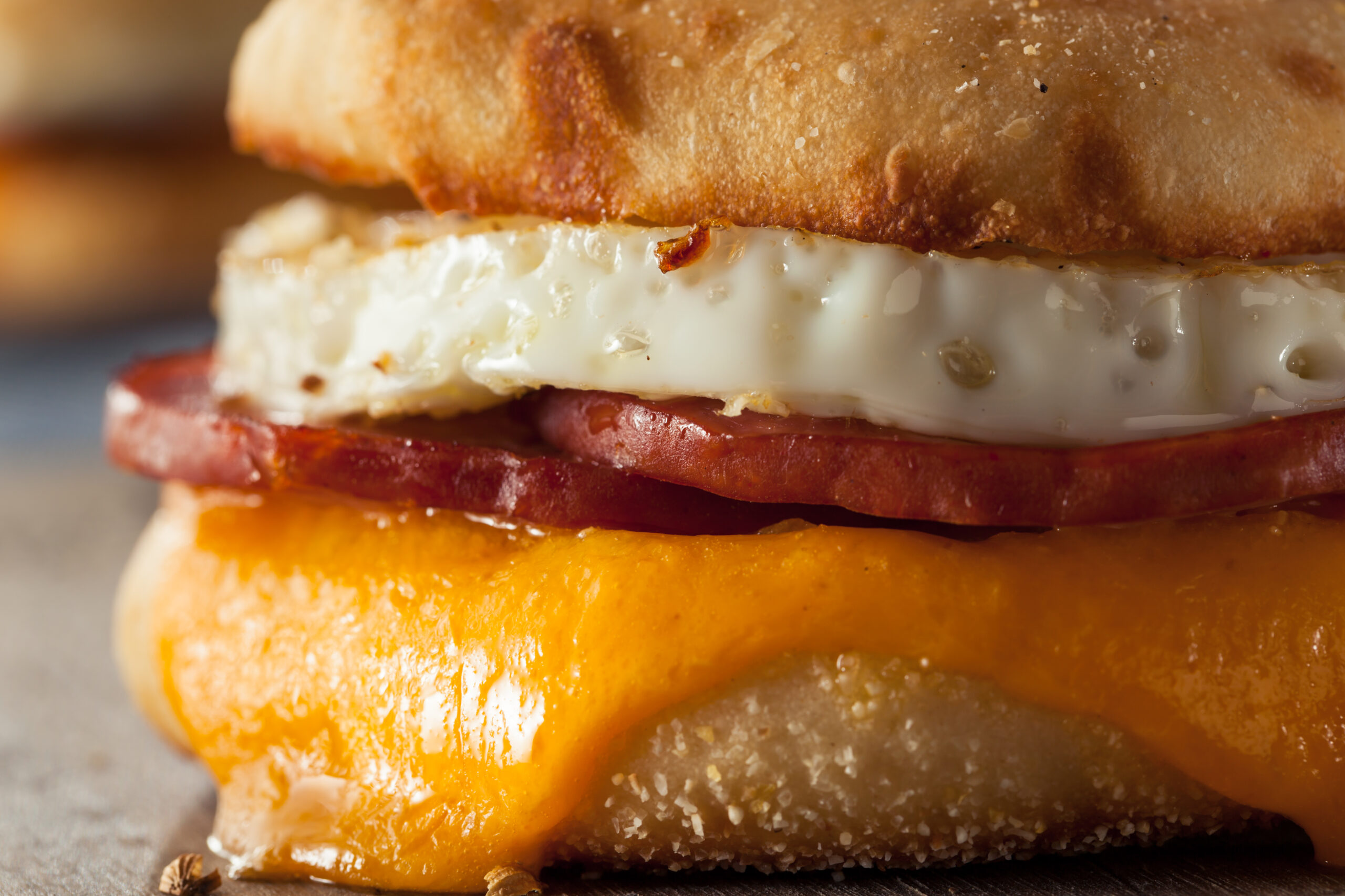 Homemade Breakfast Egg Sandwich with Cheese on an English Muffin