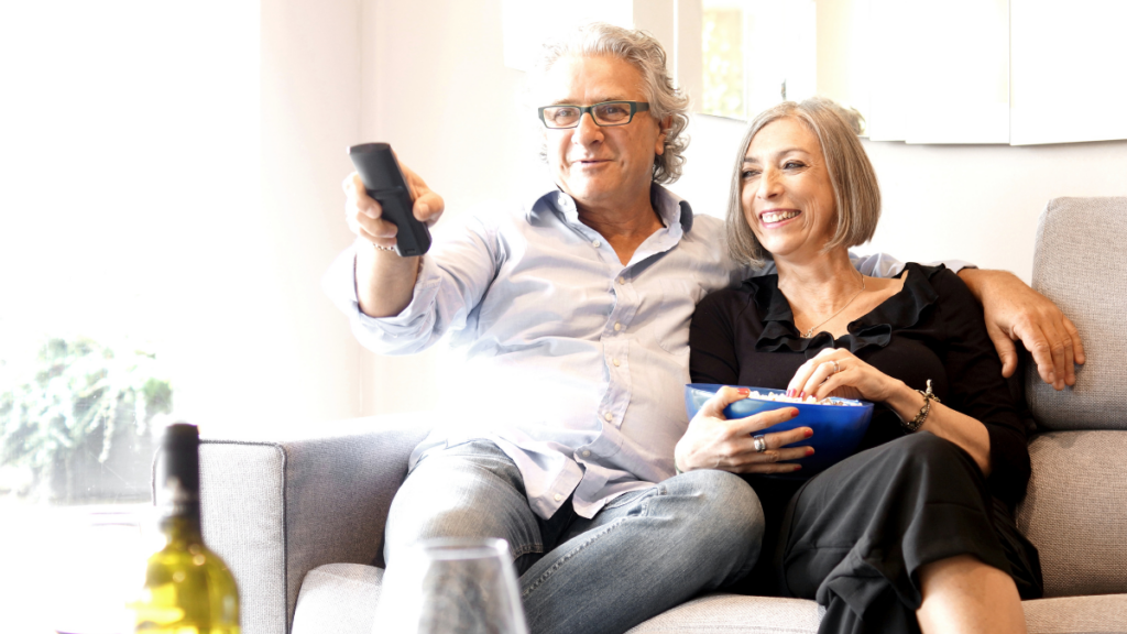 elderly couple watching tv