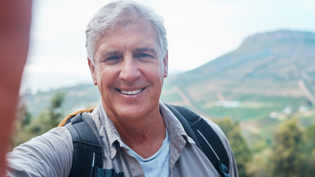 elderly man with backpack