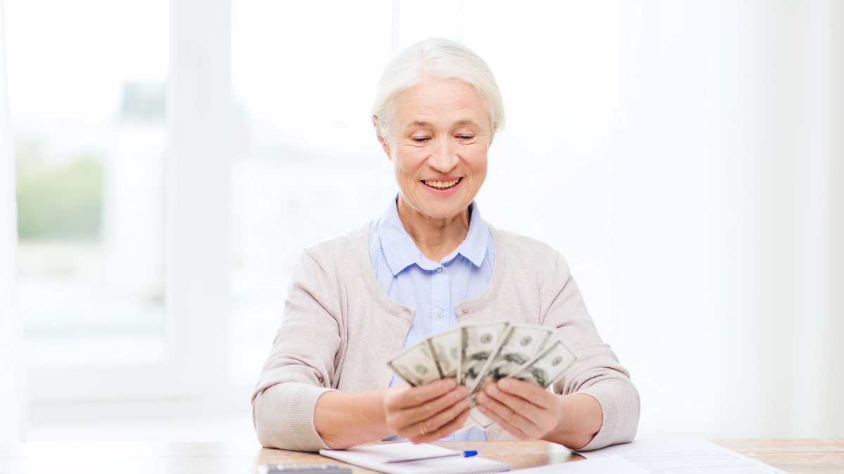 elderly woman with money