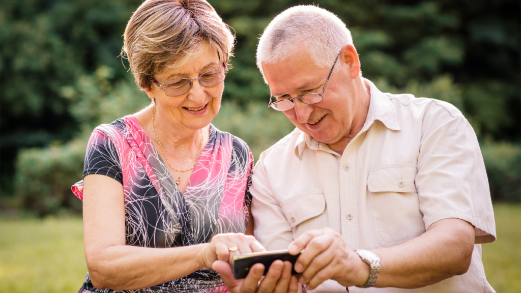 older couple looking at phone