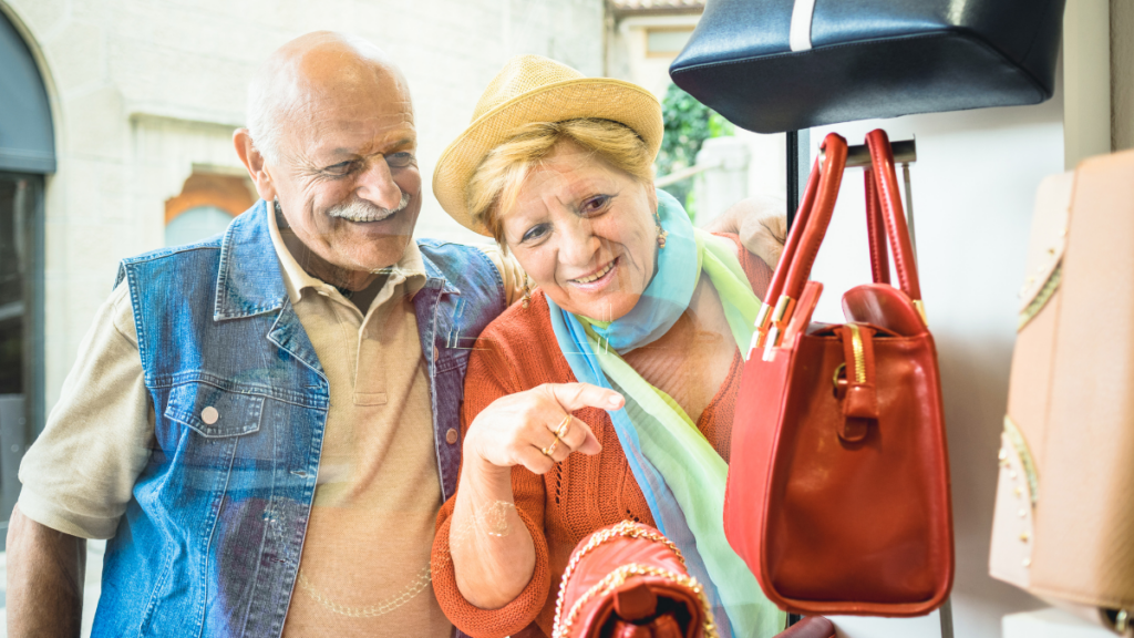 older couple looking at purses