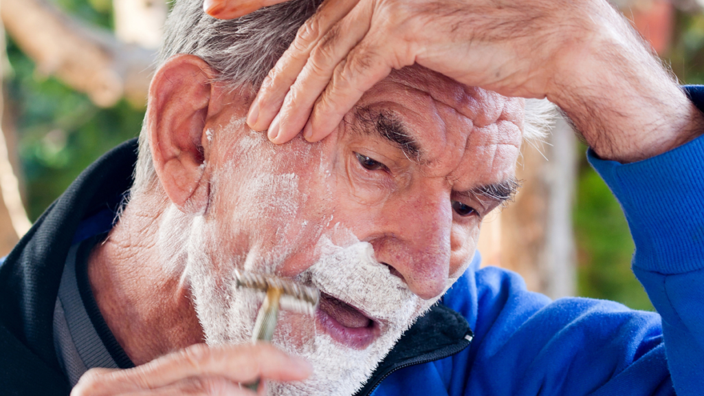 older man shaving