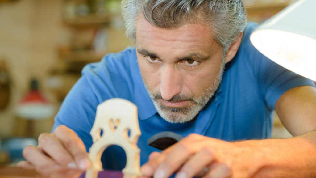 older man working with wood