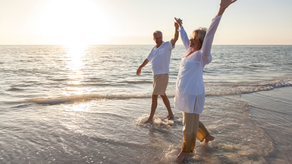 retired couple on the beach