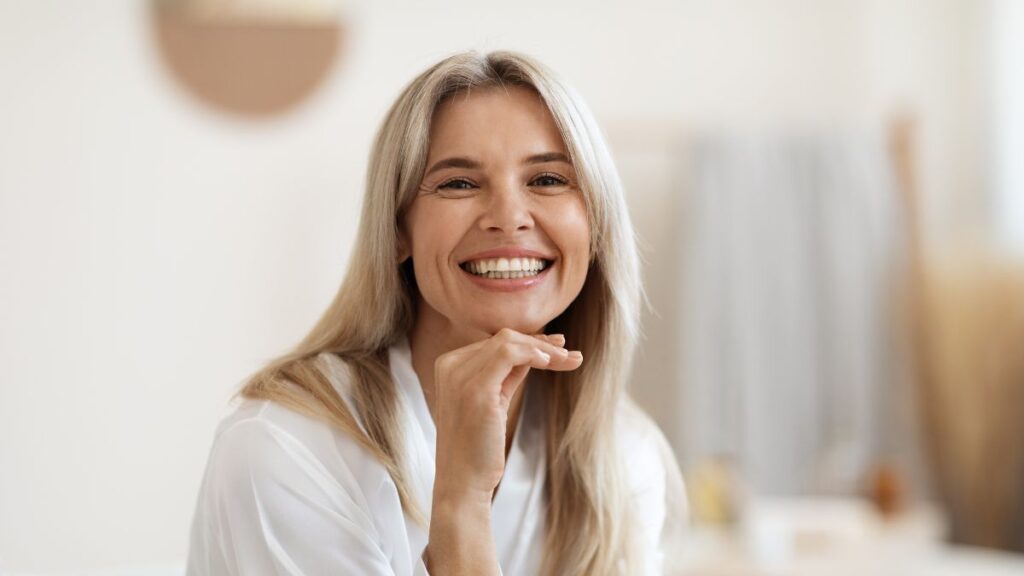 Happy Woman wearing white in her room