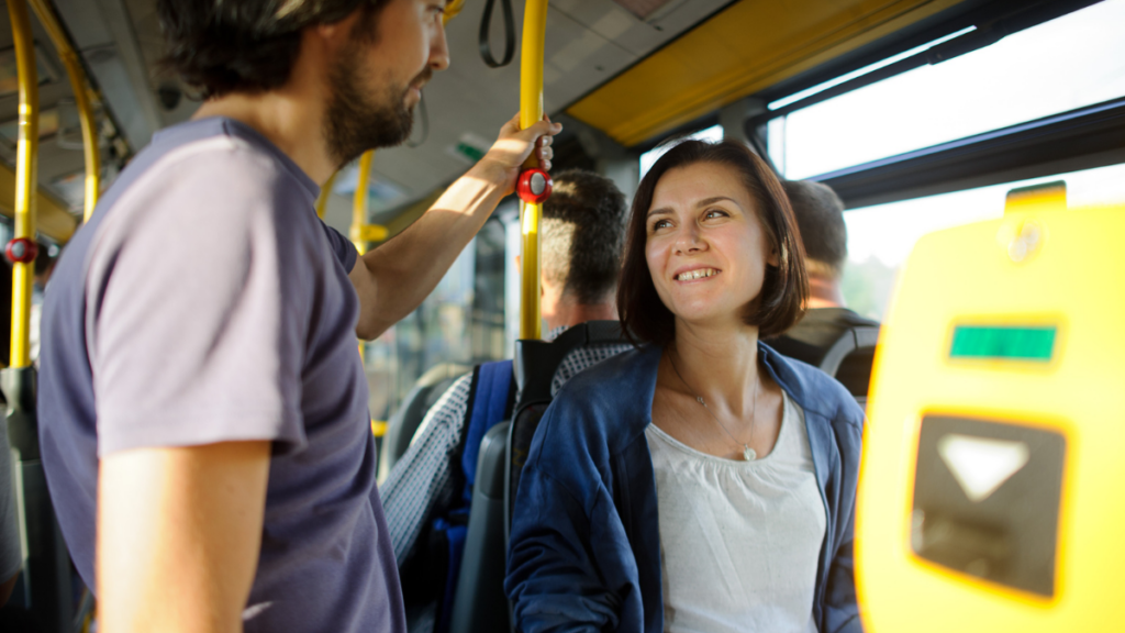 Man Woman Bus Sit Stand