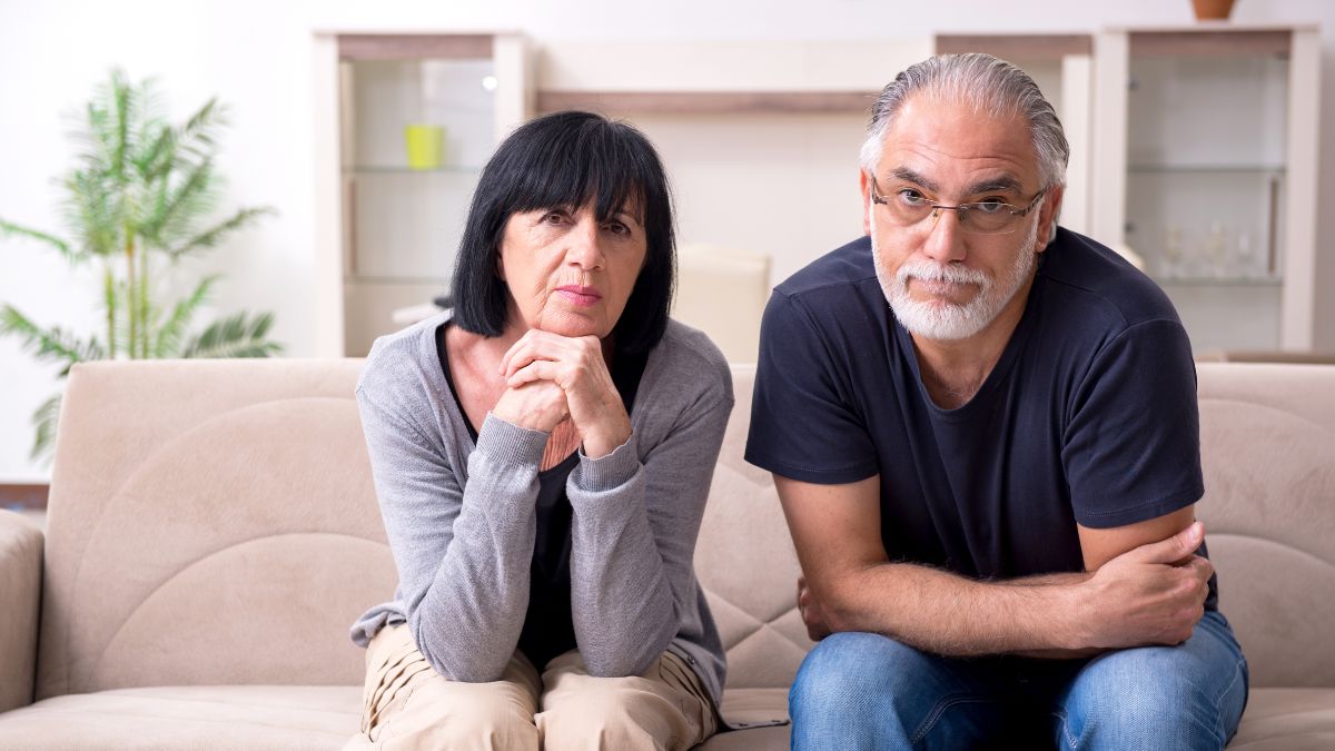 Older couple looking worried