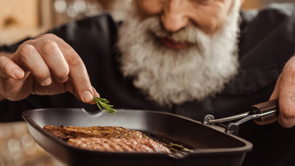 Older man cooking