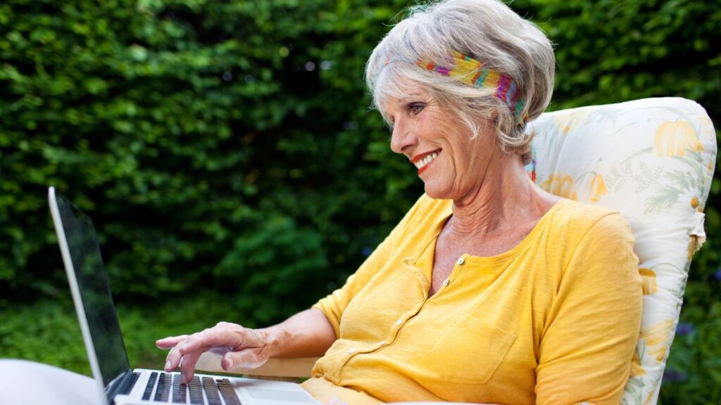 Older woman working on a laptop