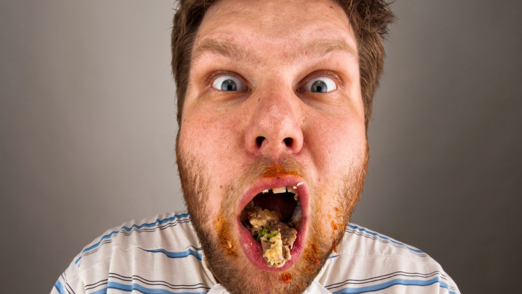 man with a food in mouth