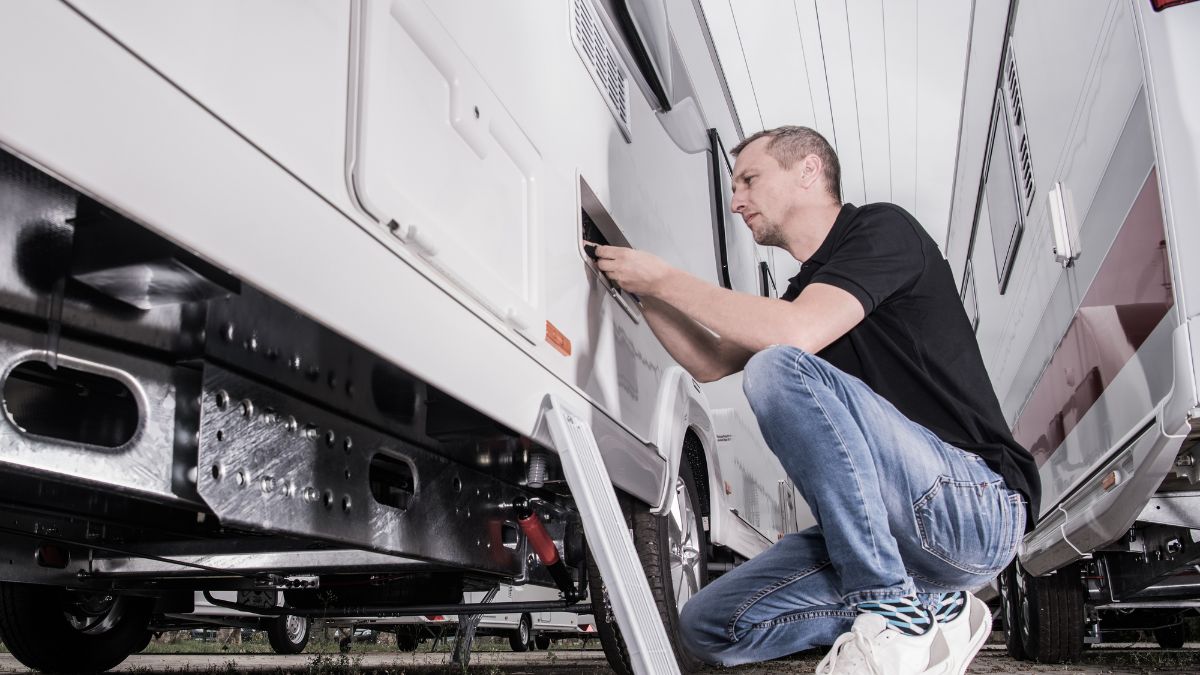 man working on RV