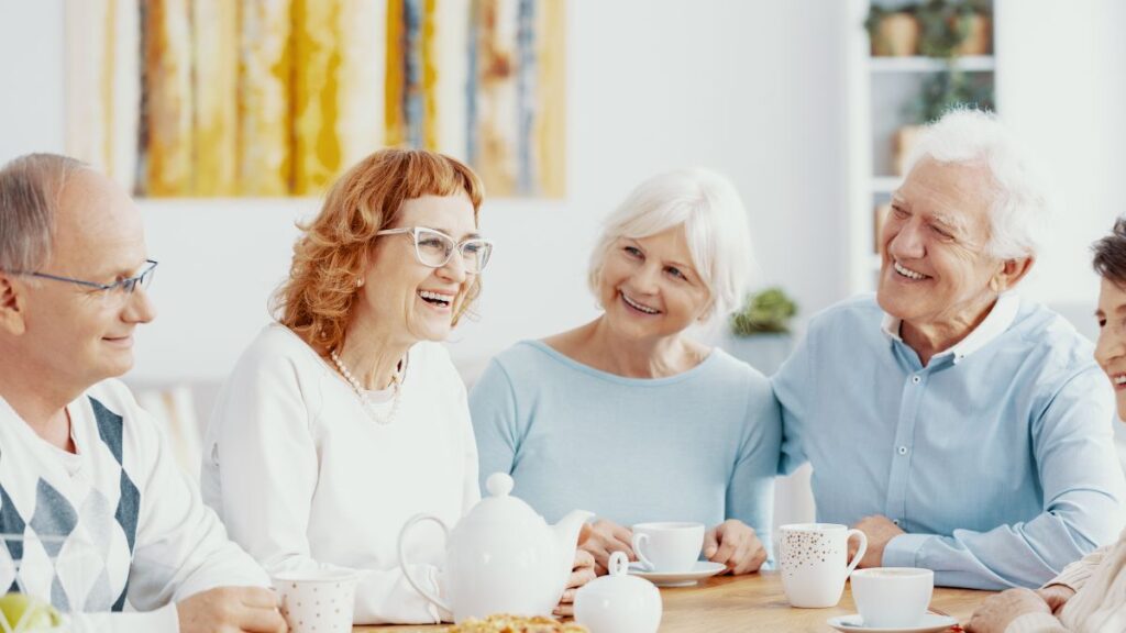 older couples having tea or coffee at a table