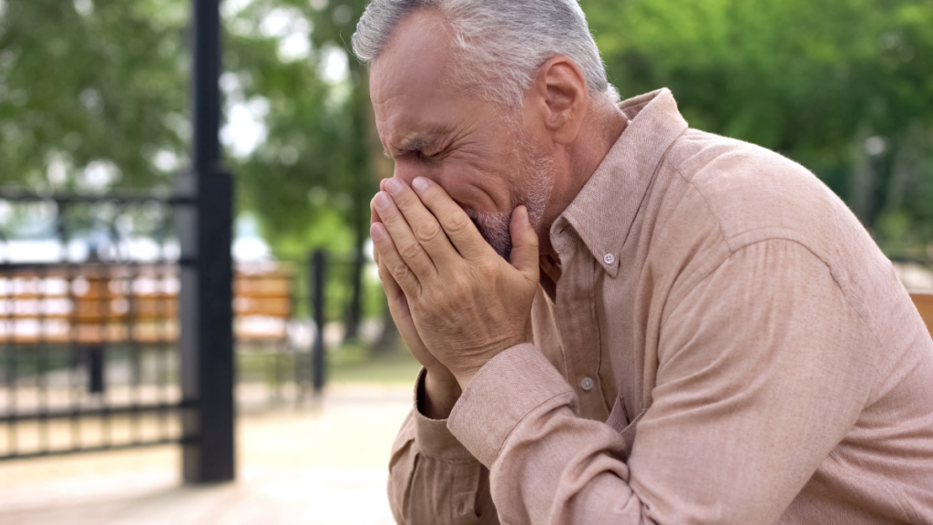 older man crying