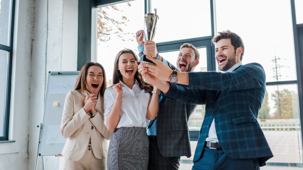 people excited with trophy