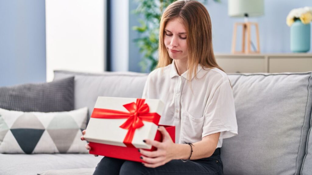 woman looking disappointed at gift