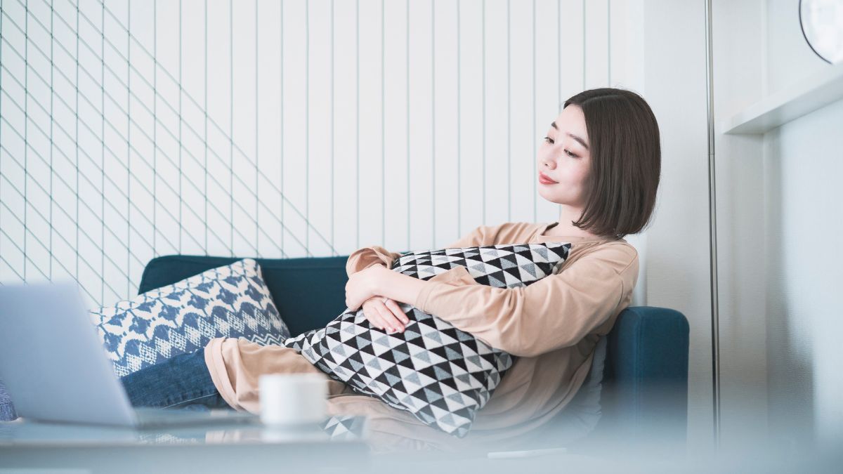 woman sitting on couch