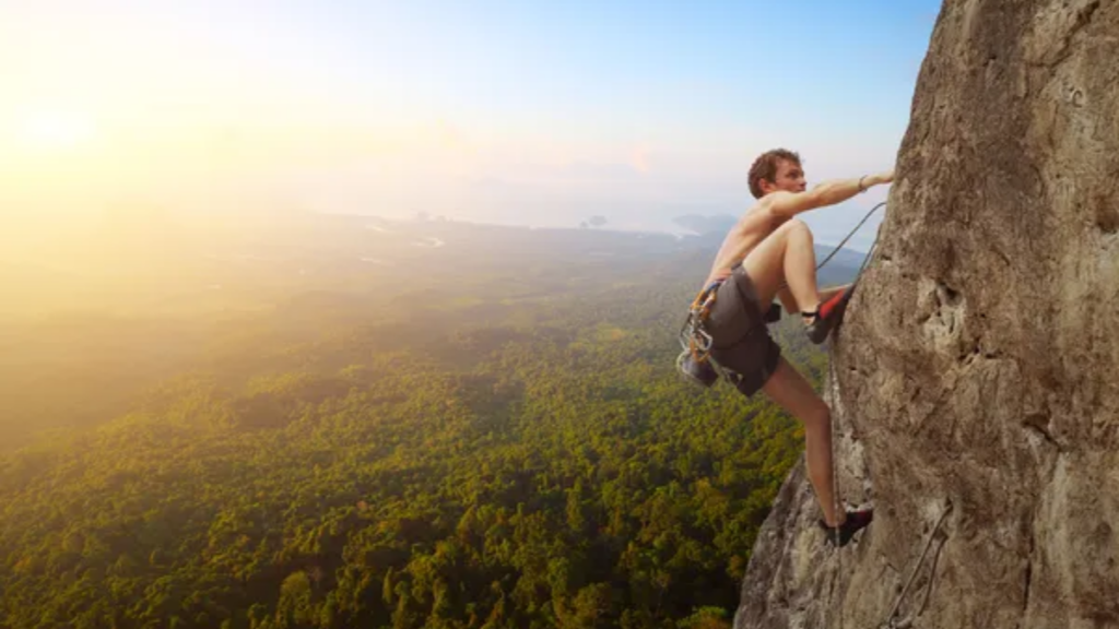 Man Rock Climbing