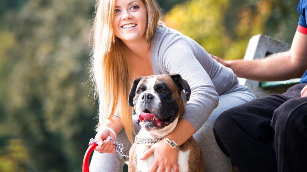 Woman holding her dog close