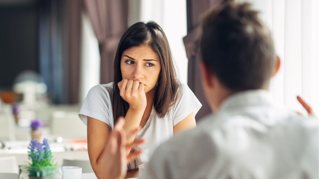 Woman looking bored and upset at a restaurant