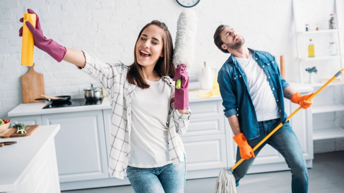 couple dancing and cleaning