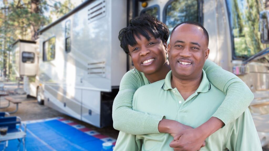 couple hugging outside rv