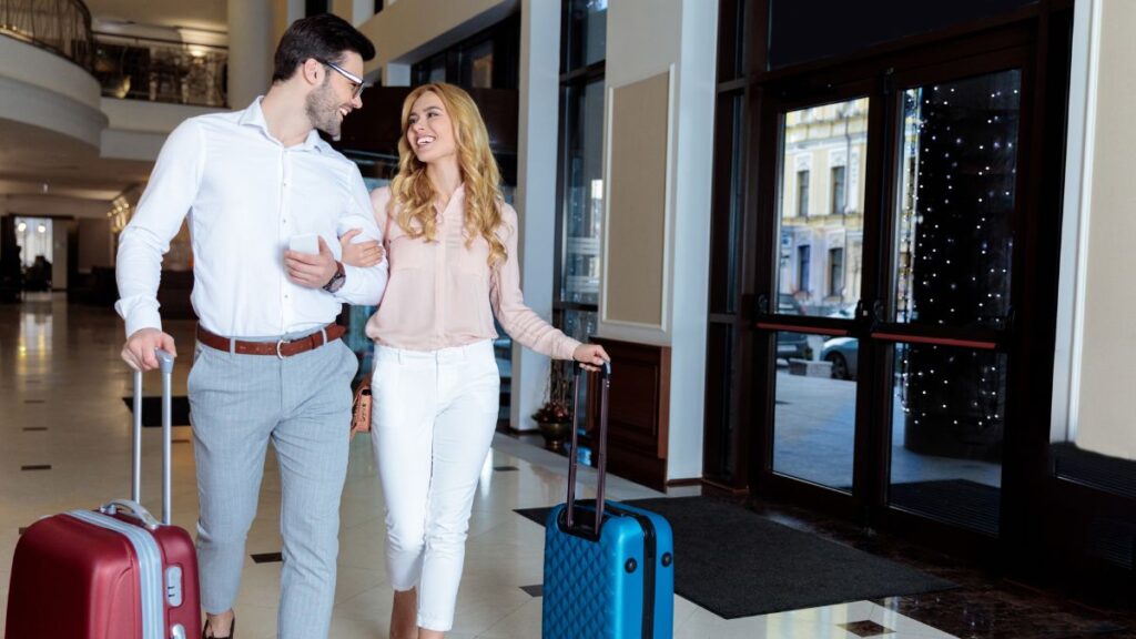 couple walking out of hotel