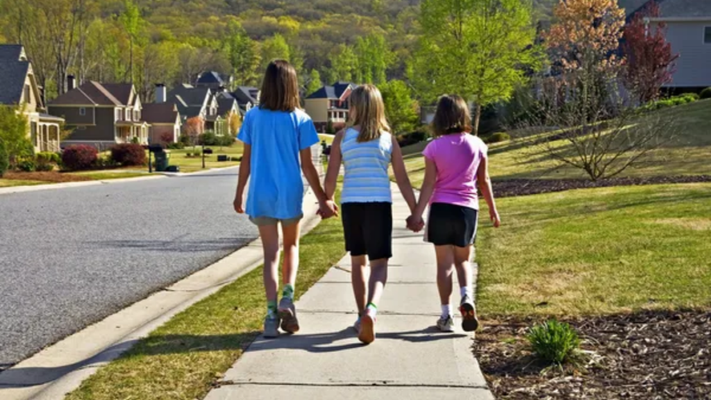 girl walking in neighborhood