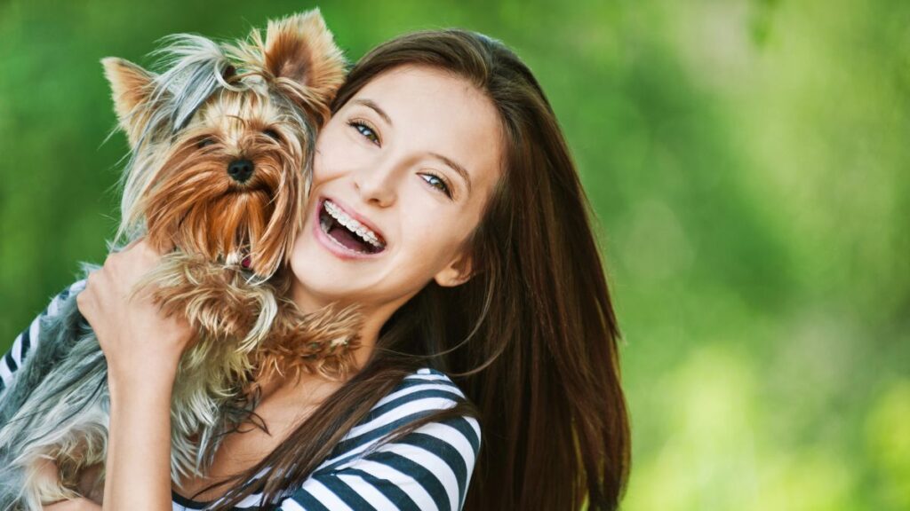 happy woman hugging a dog