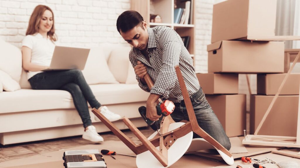 man putting a chair together