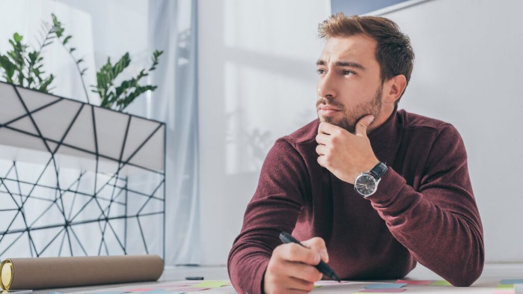 man thinking at desk