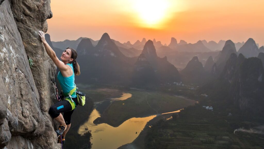 woman climbing a mountain