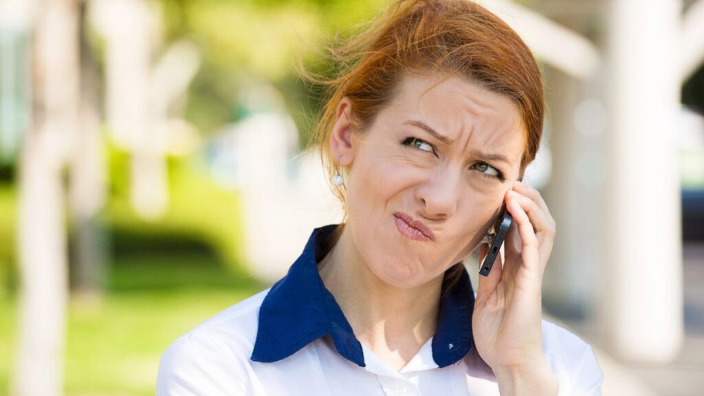 woman on the phone with a questioning look