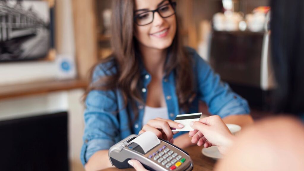 woman paying with her card