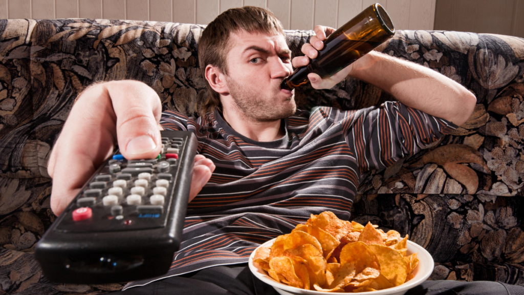 Man Eatings Chips Drinking Beer