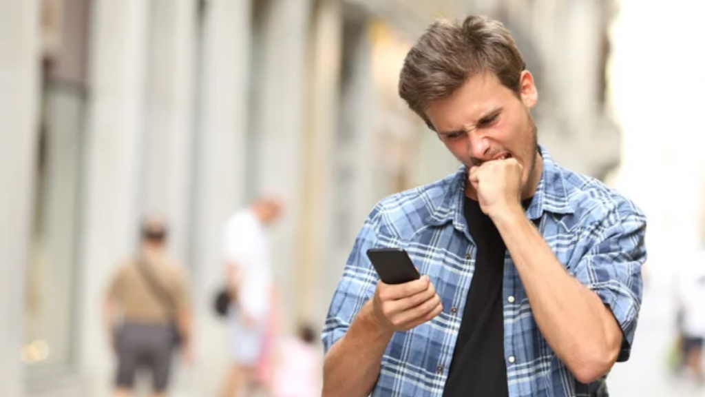 Man Phone Biting Fist