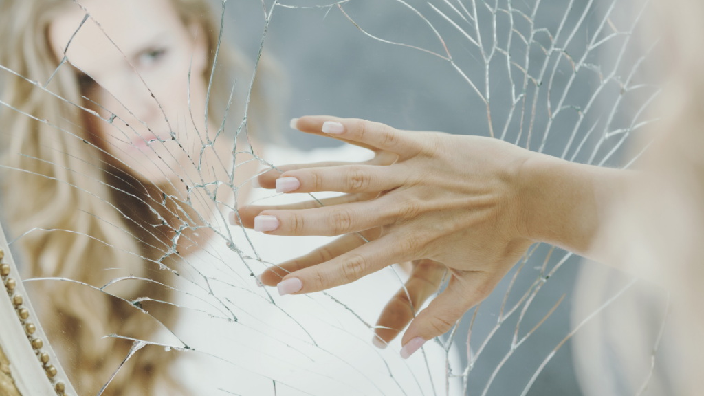 Woman Broken Mirror