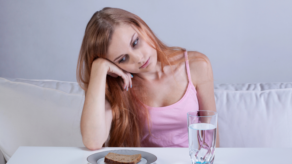 Woman Eating Sad