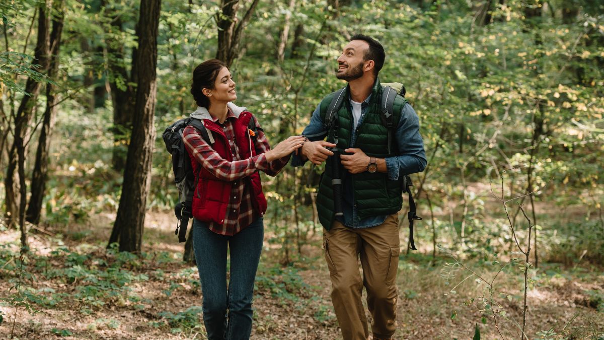 couple walking through the woods