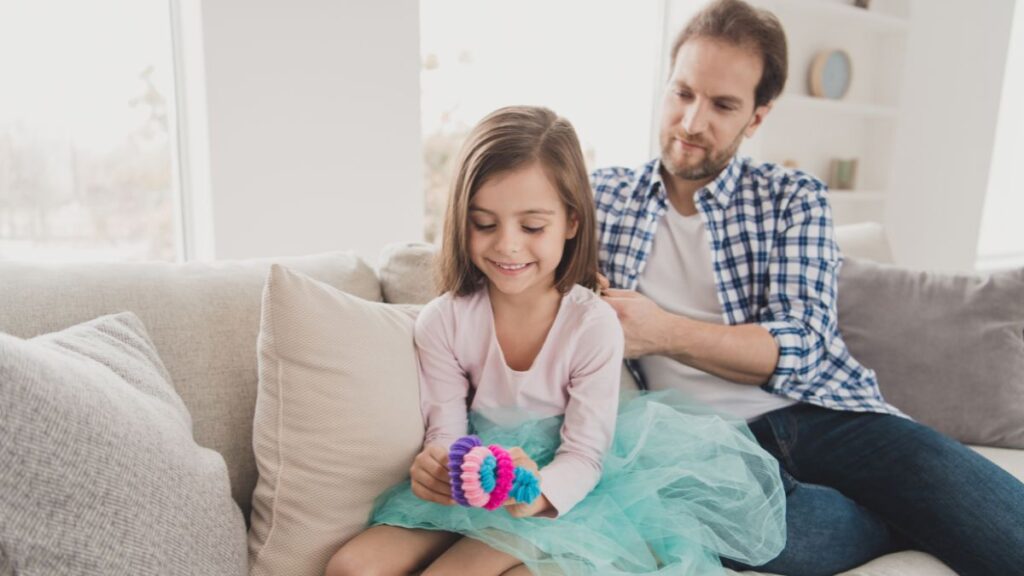 dad putting scrunchy in girls hair