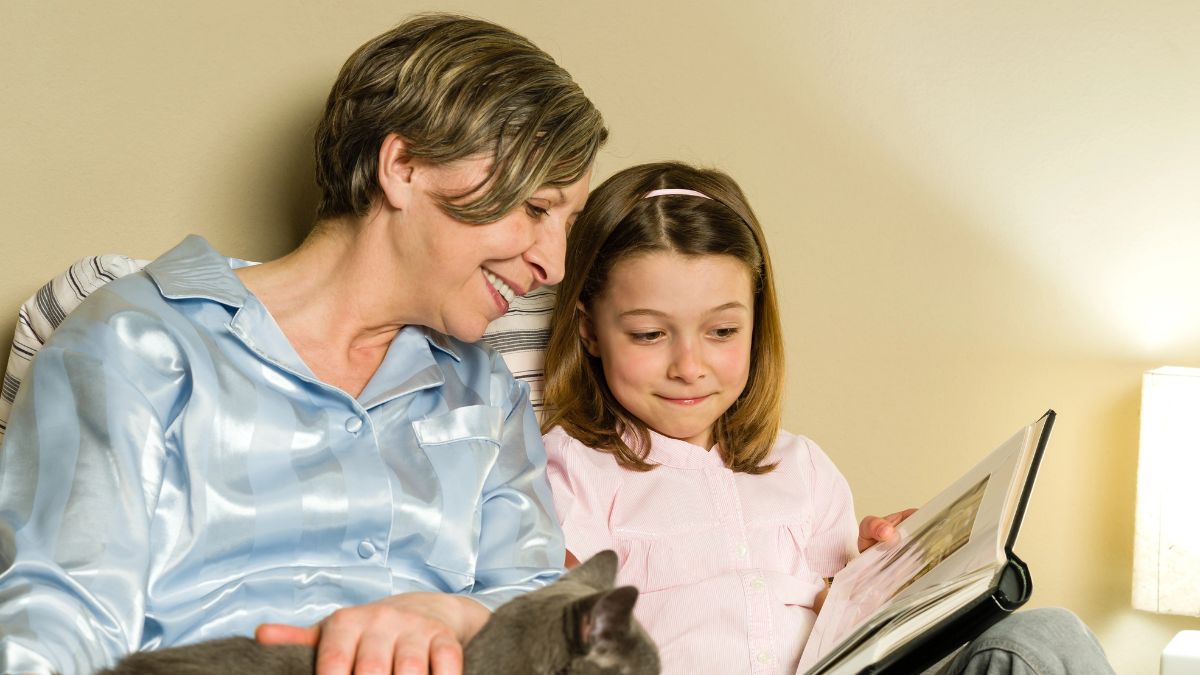 grandma and daughter looking on pictures