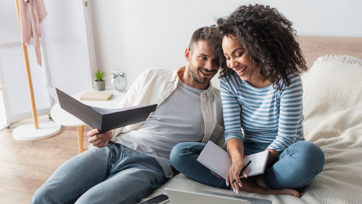 happy couple doing bills and planning for future