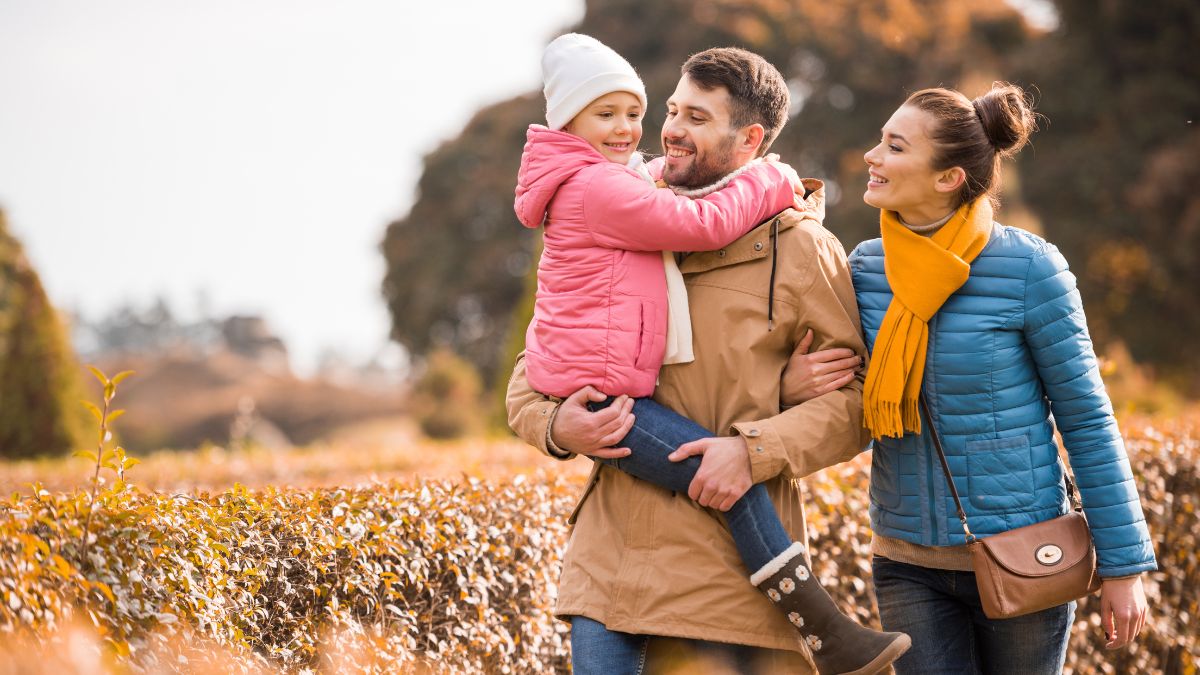 happy family walking outside