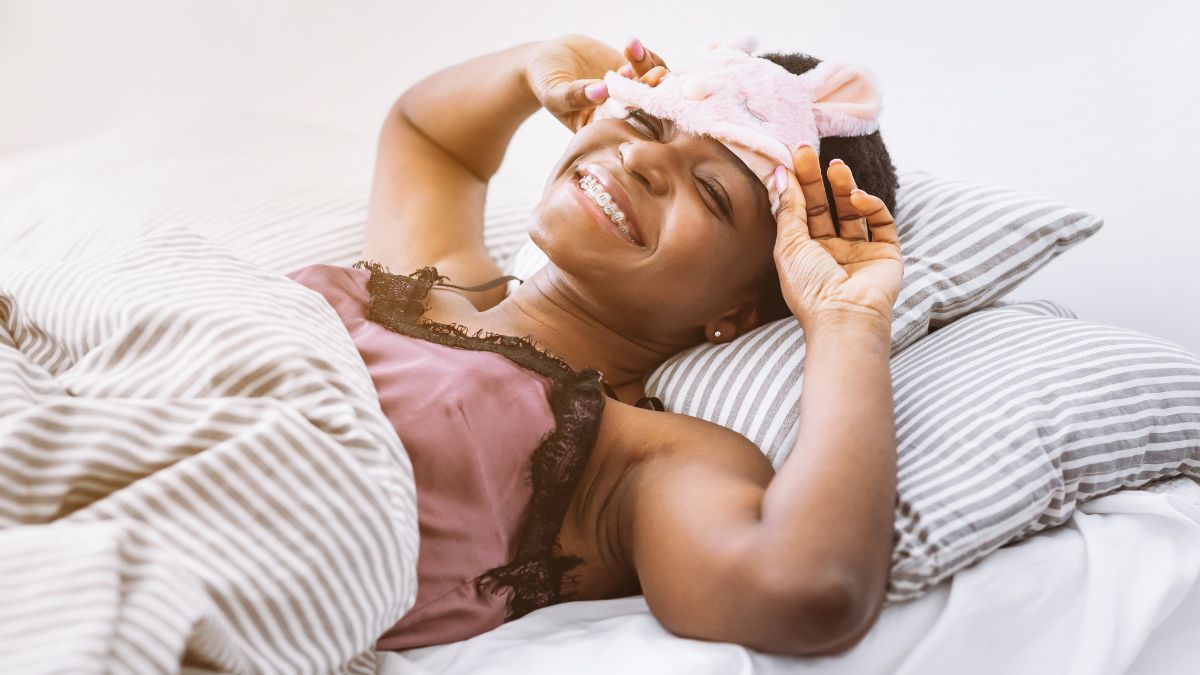 happy woman laying in bed