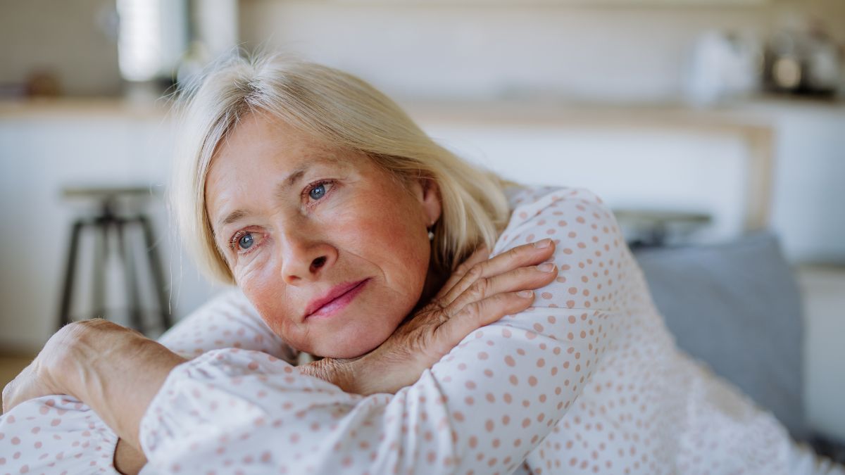 older woman looking tired