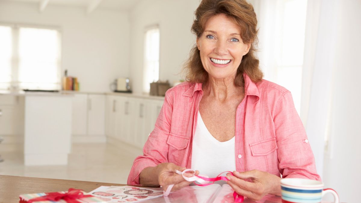 older woman scrapbooking