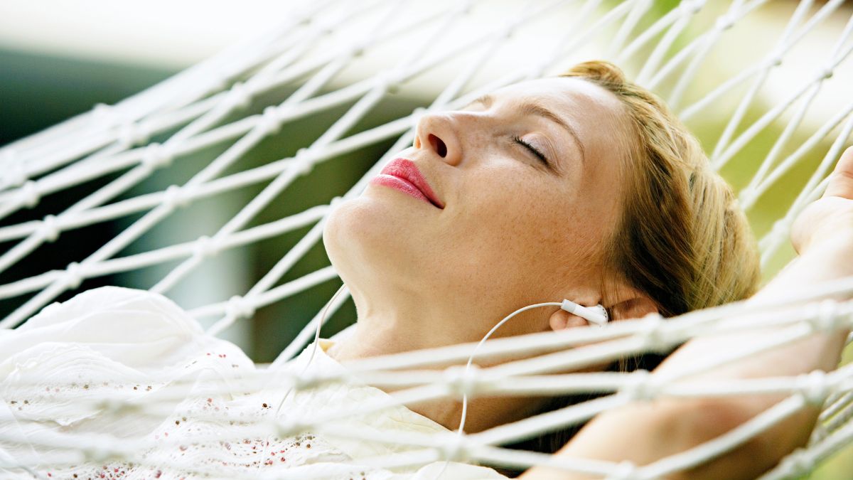 rest resting in hammock with headphones