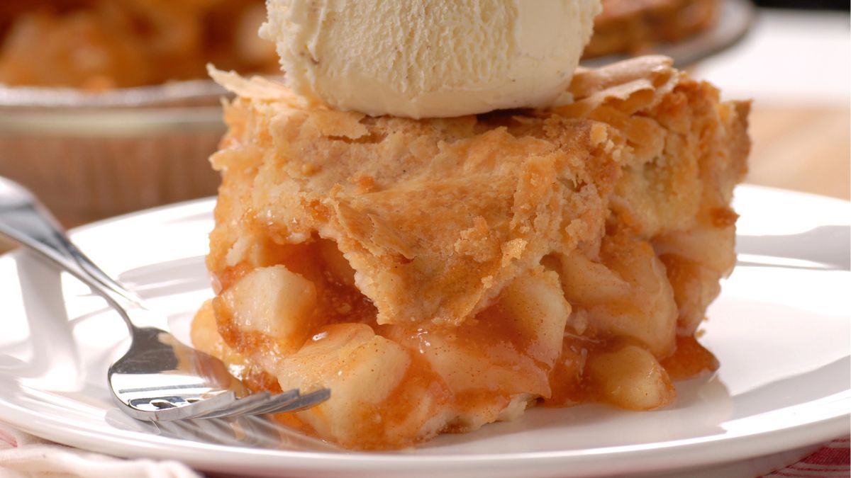 slice of apple pie and ice cream on top