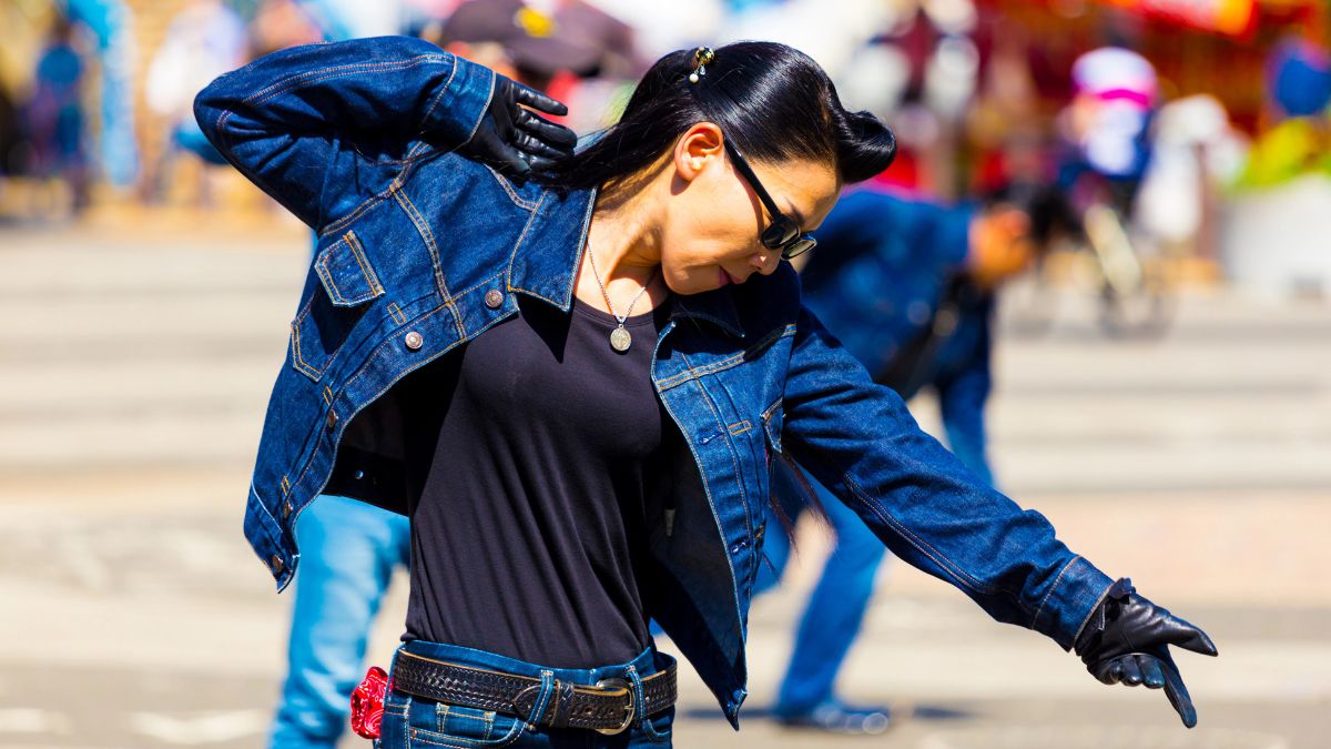 woman dancing in jean jacket