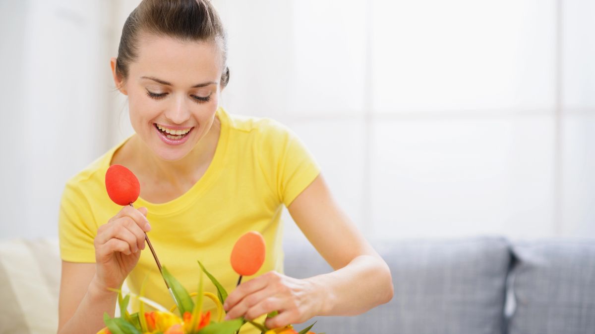 woman doing floral arrangement